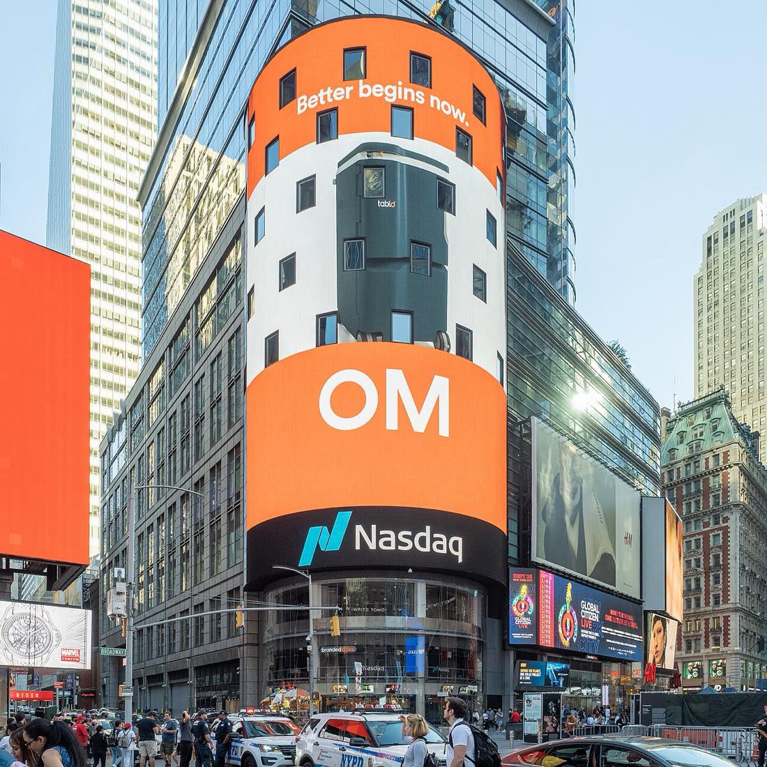 The Nasdaq MarketSite tower in Times Square, with the Nasdaq logo on its curved video screen.